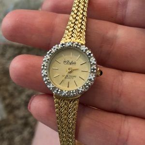 ladies Dufante gold watch with diamonds